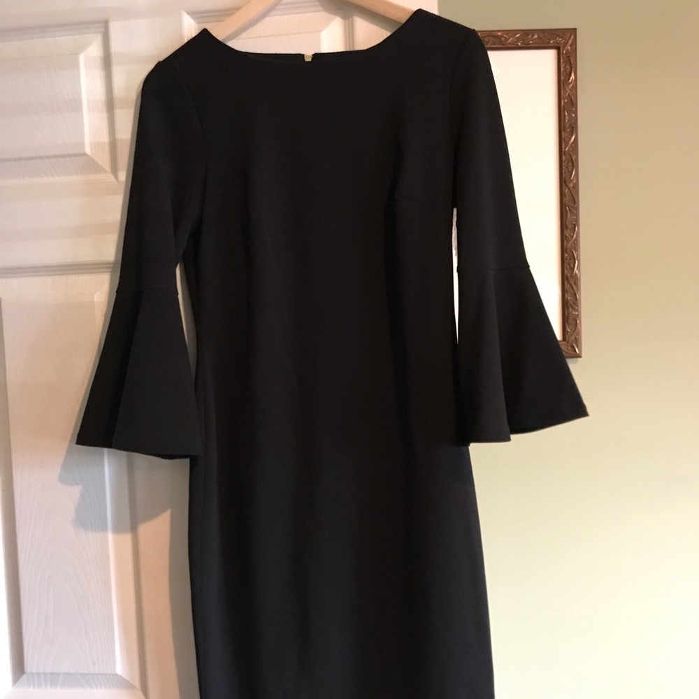 Calvin Klein black dress with bell sleeves.